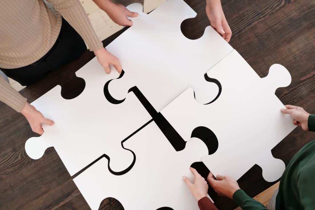 close-up-photo-of-people-holding-puzzle-pieces
