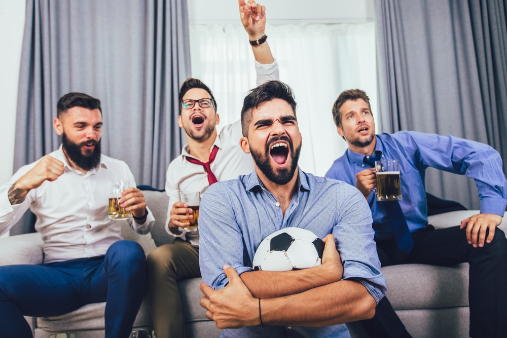 men watching a football game at home