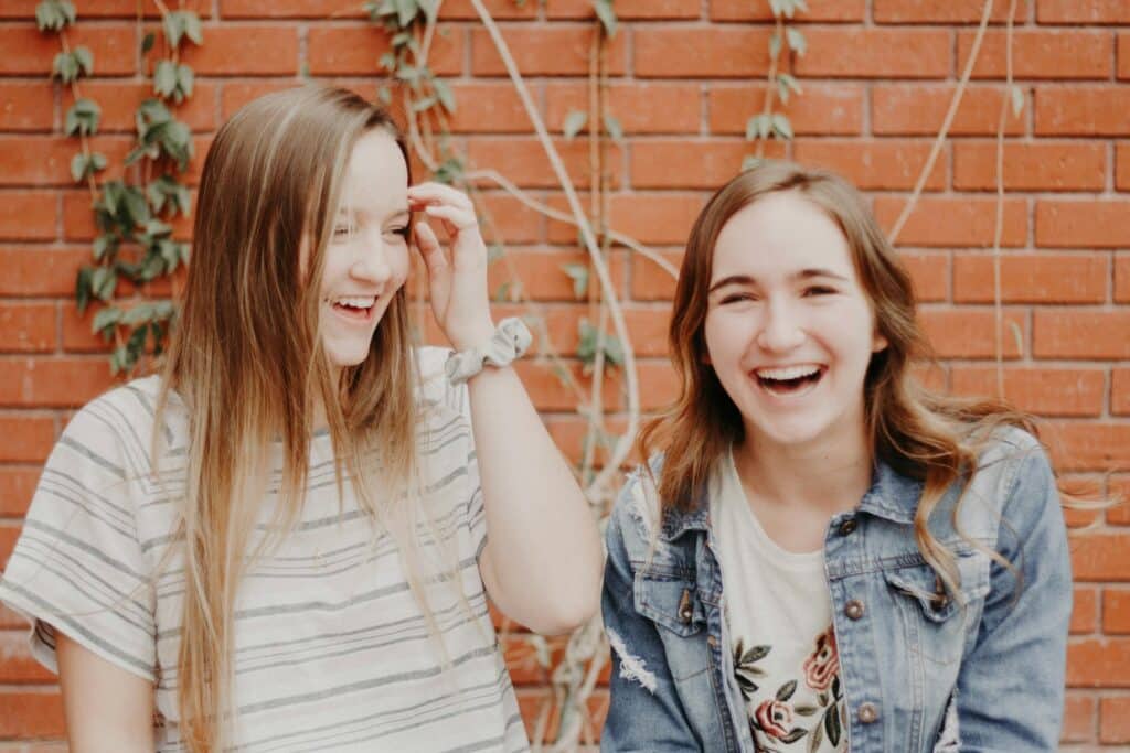 two-young-women-smiling-and-laughing