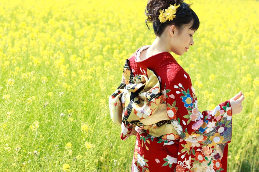 Woman wearing a red kimono with floral designs