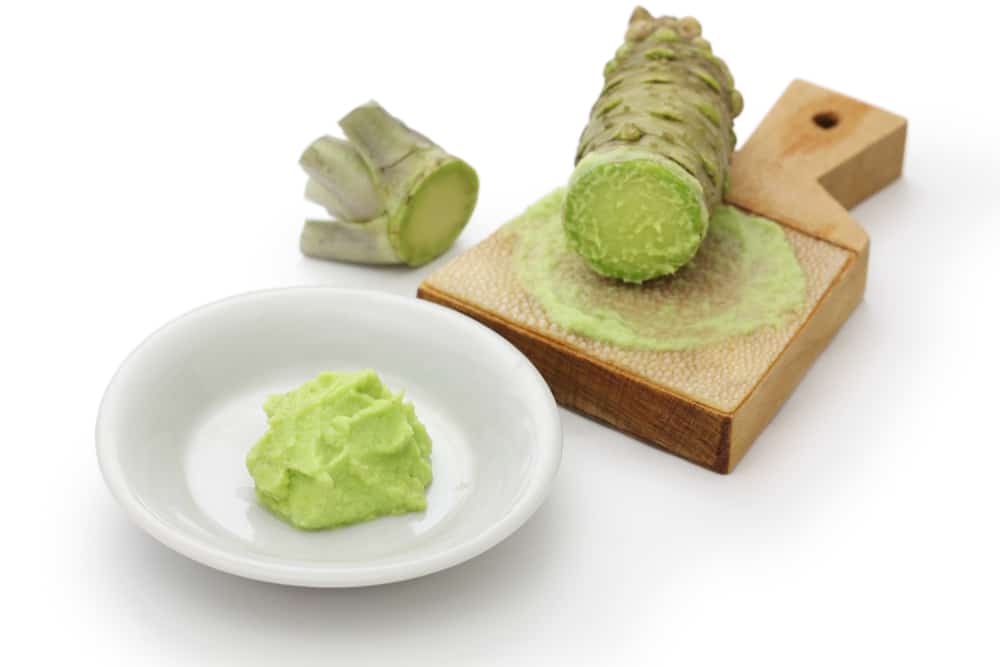 Wasabi rhizome pictured with sharkskin grinder and wasabi paste
