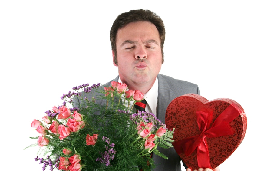 Man with flowers and a heart box