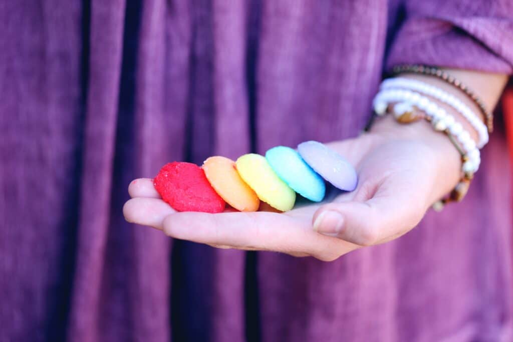 woman-holding-colored-cookies