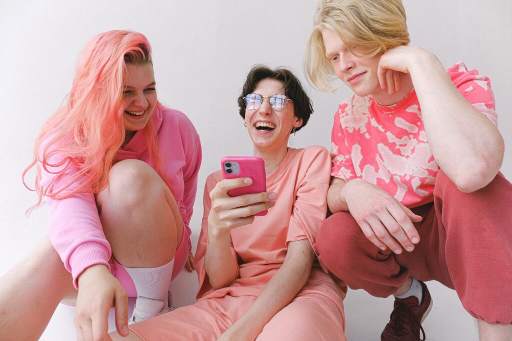 Three women watching a show on their Android device
