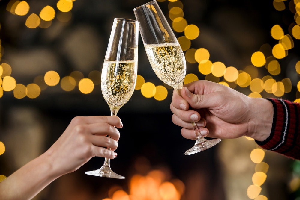 couple celebrating with champagne in christmas