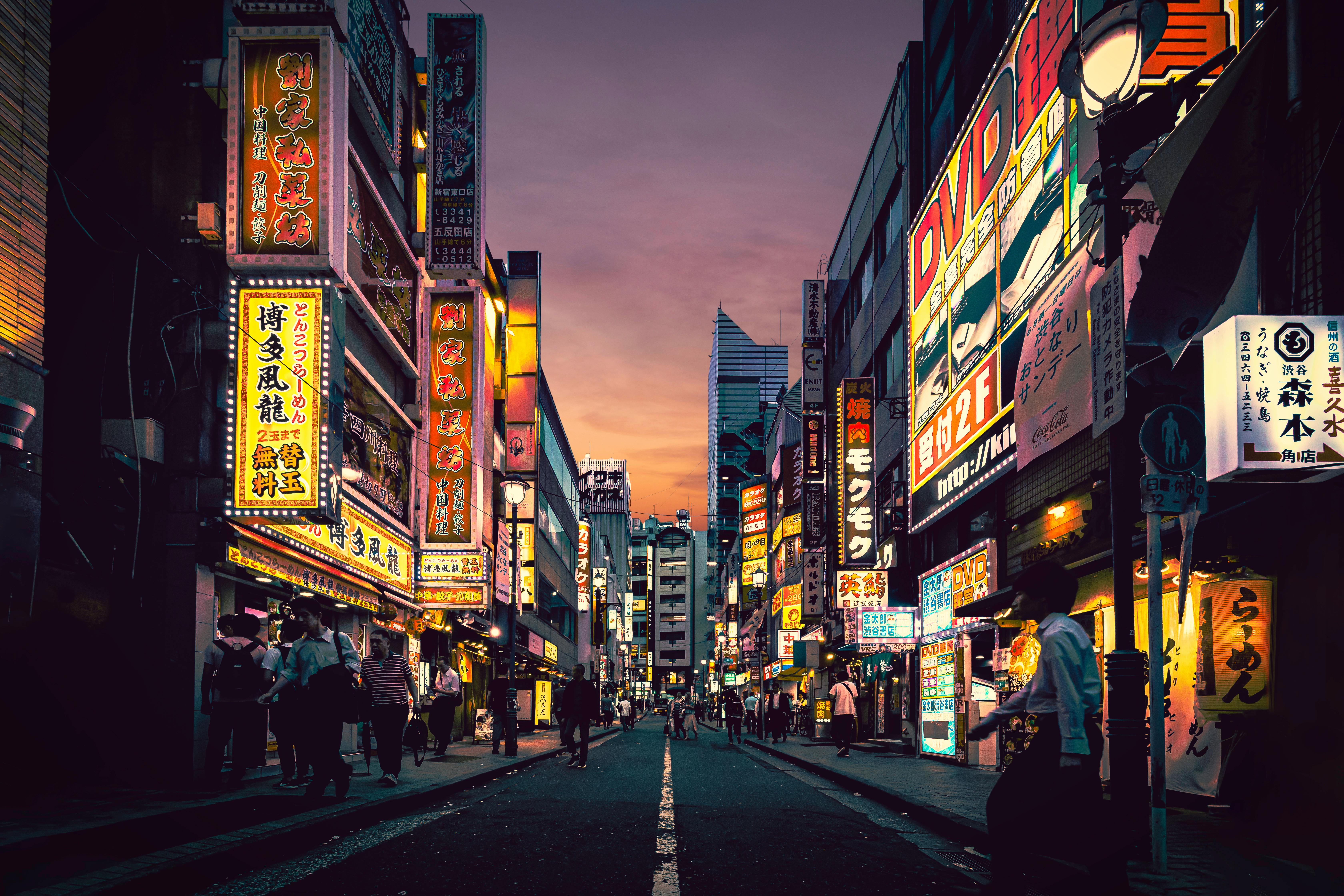 A Japanese street lit up at night
