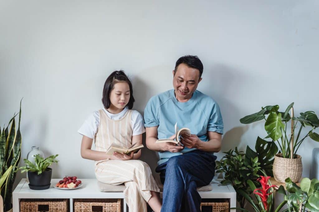 father-and-daughter-reading-books-together