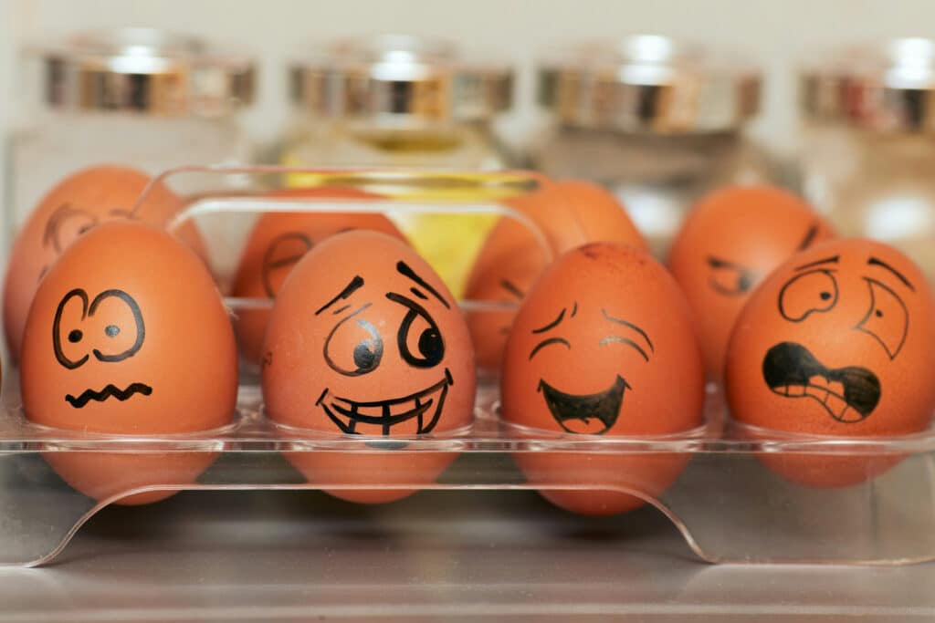Eggs with funny faces drawn on them
