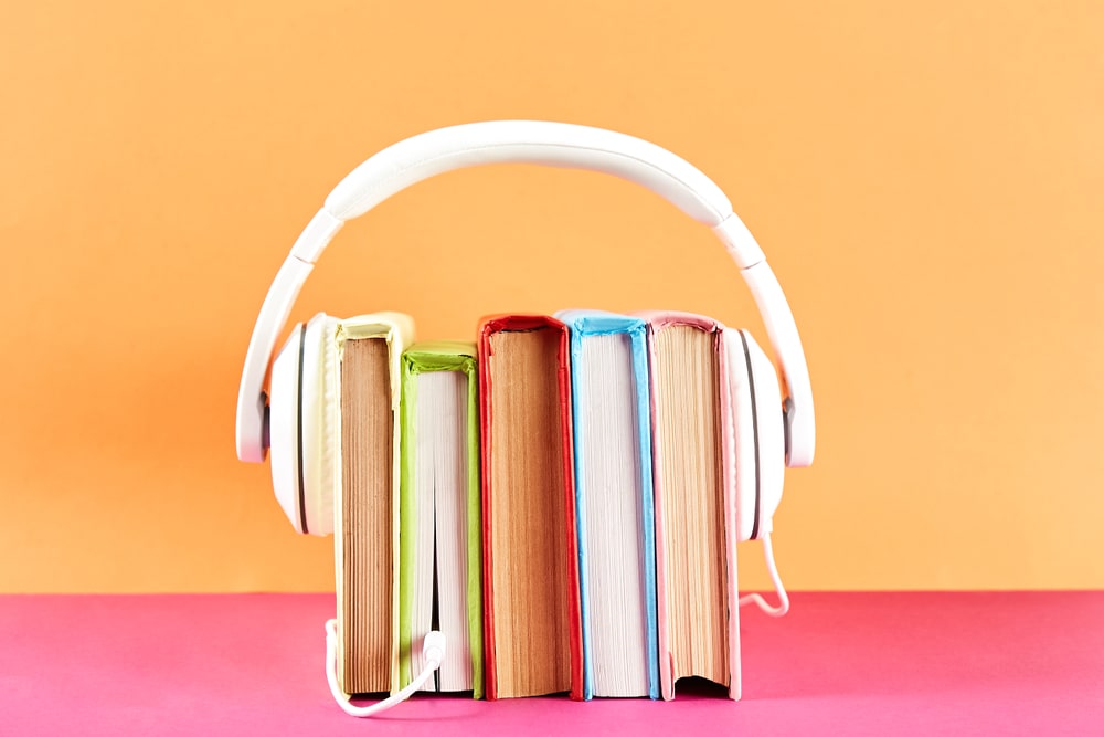 books-with-headphones-representing-audiobooks