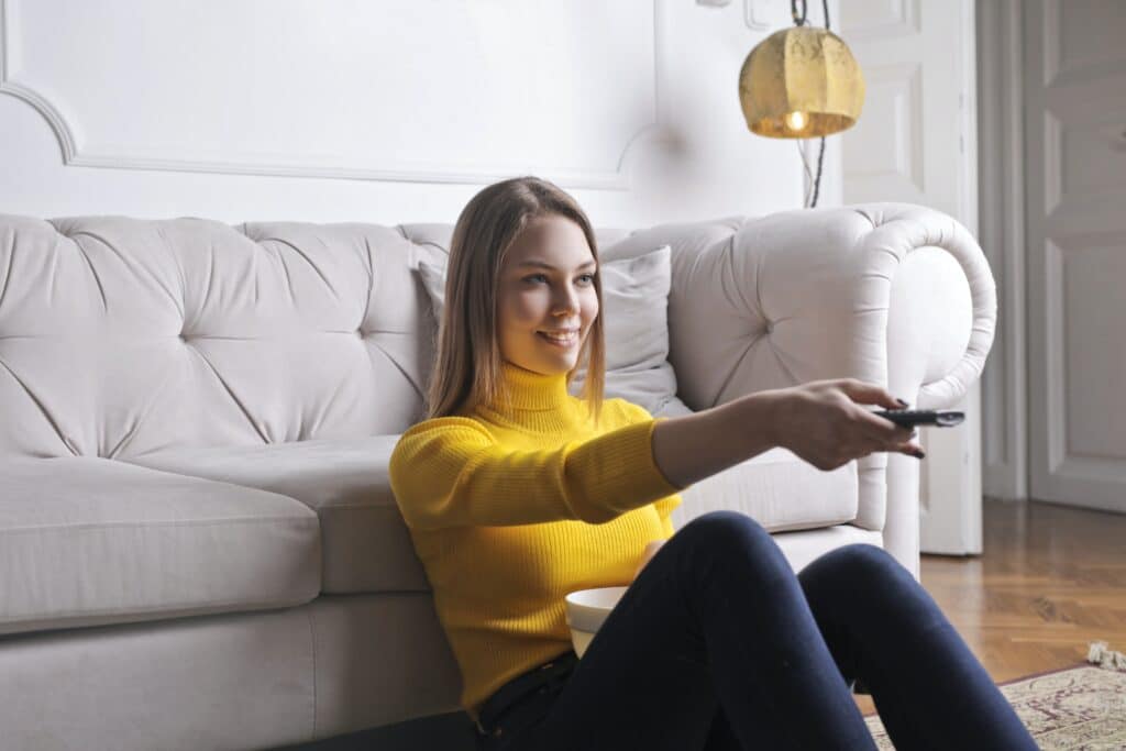 young-woman-watching-movie-at-home