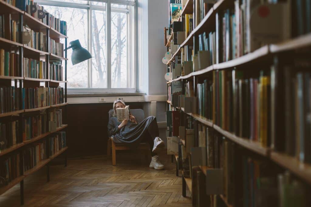 A woman reading in a library