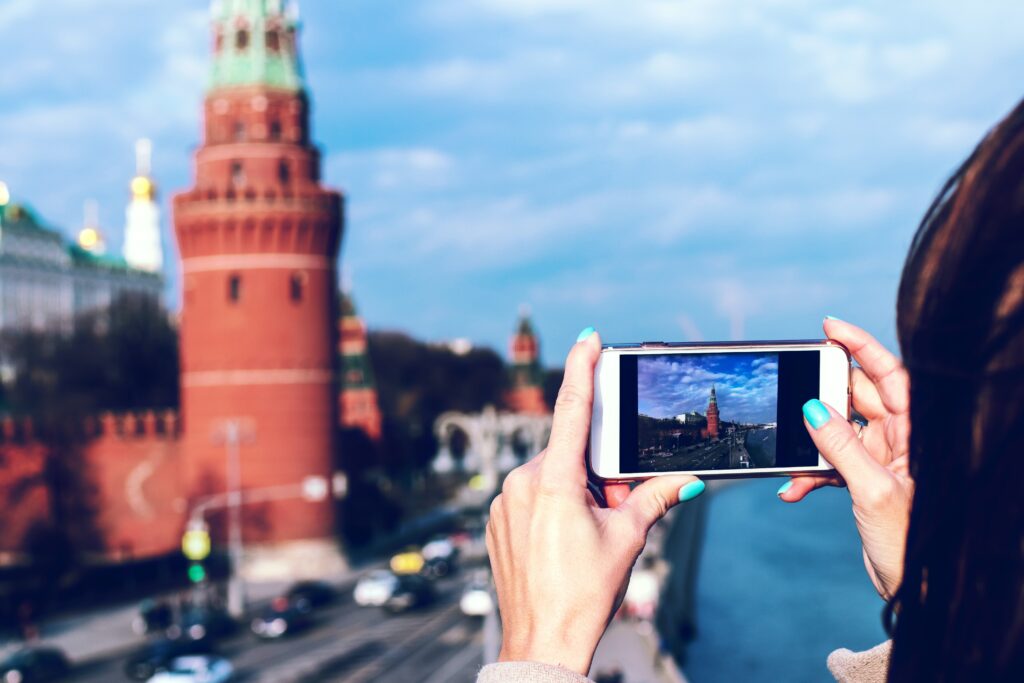 woman-taking-picture-of-building-in-moscow-russia