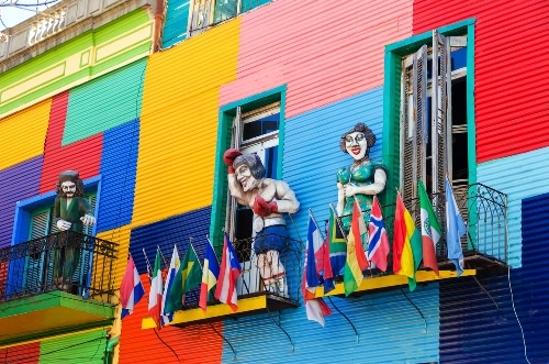 A colorful building with flags