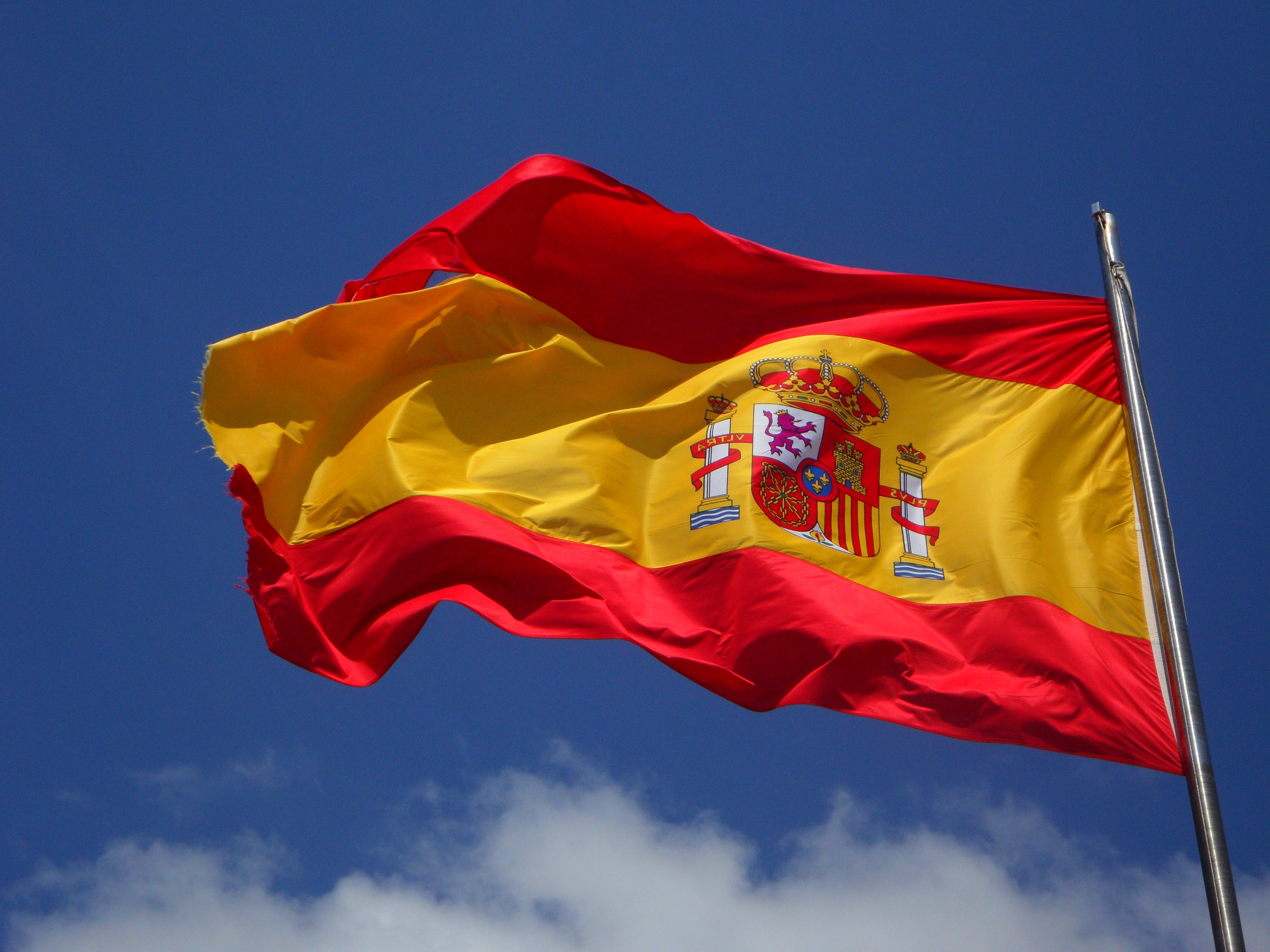 A Spanish flag flying on a pole