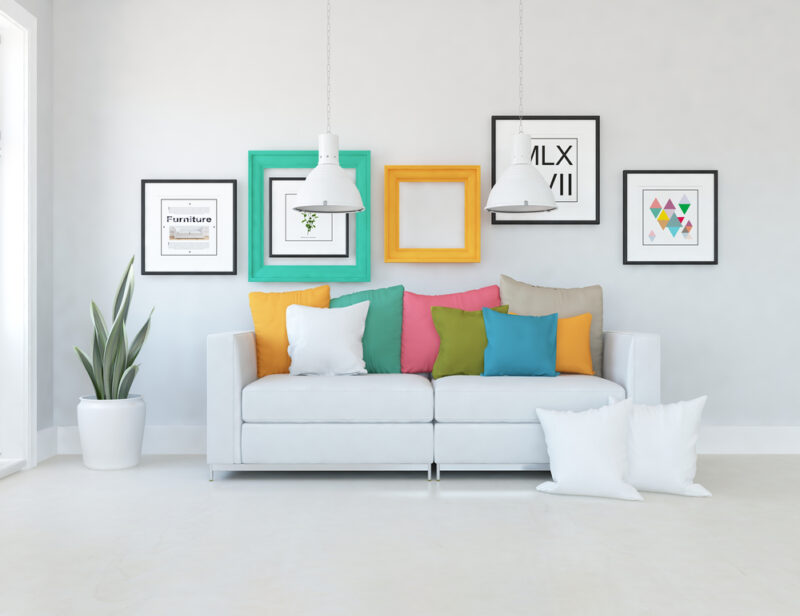 White sofa with colorful cushions on it