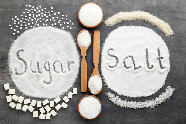The words 'sugar' and 'salt' drawn in sugar and salt