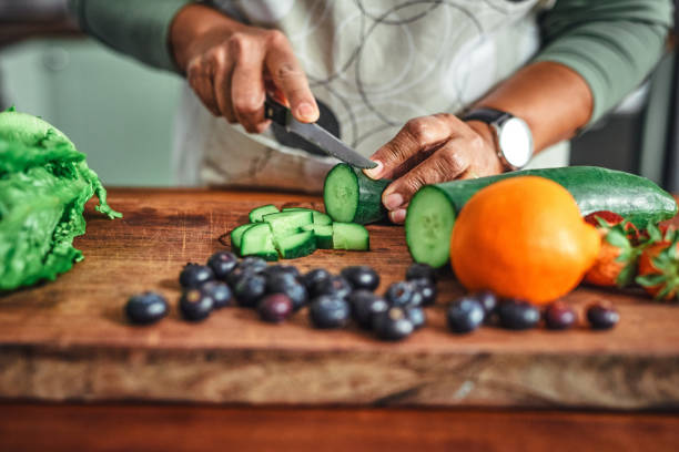 Person chopping a vegetable