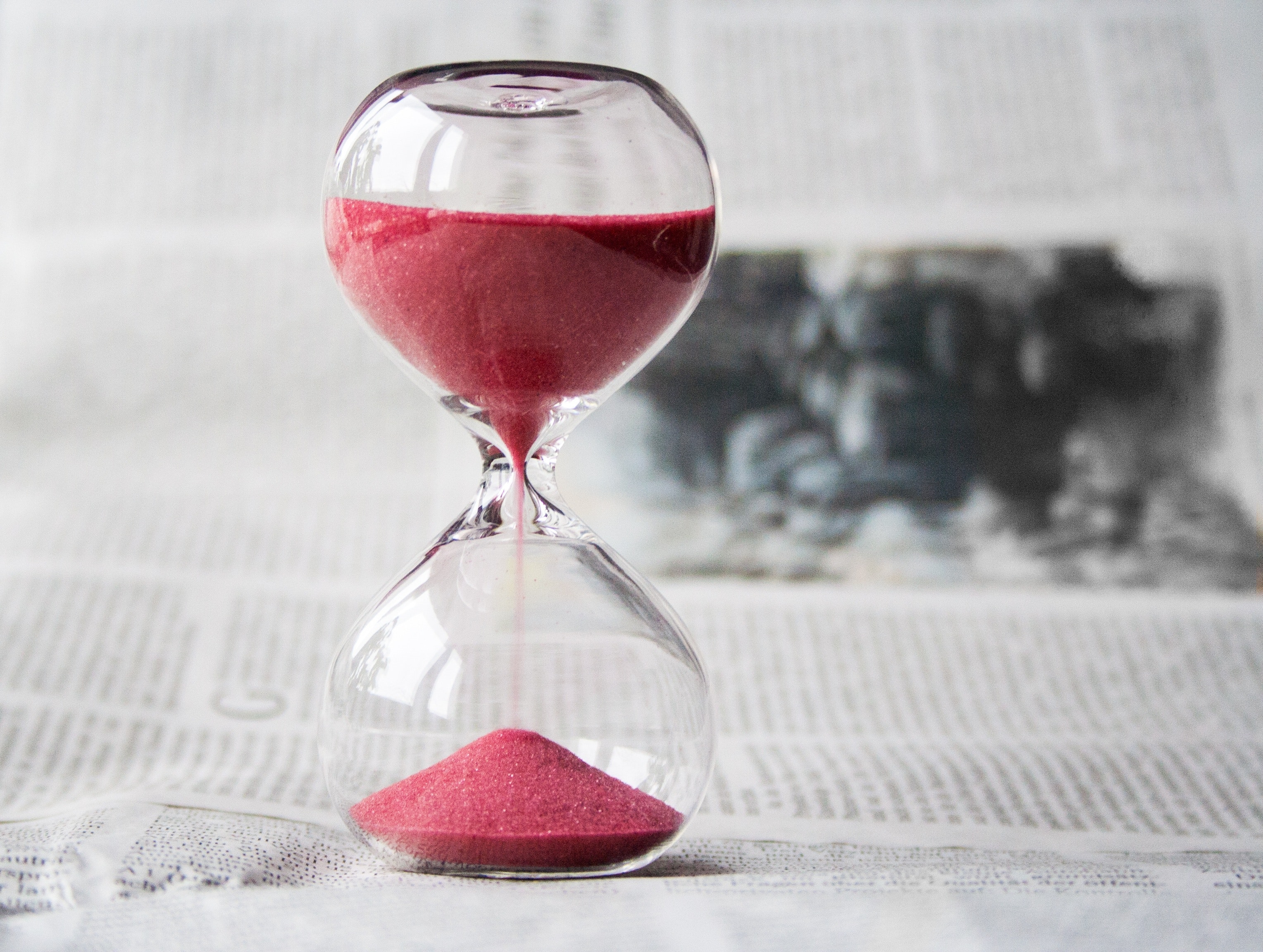 clear-hourglass-with-red-sand