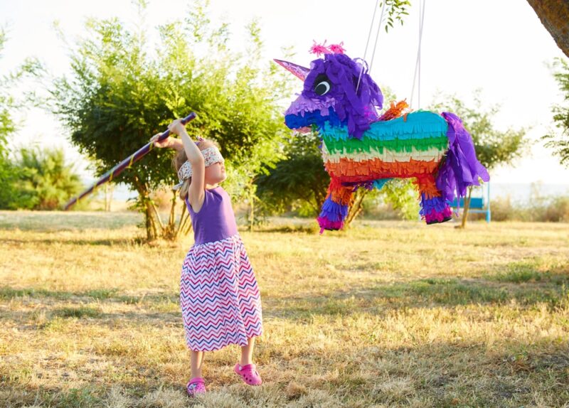little-girl-hitting-a-piñata