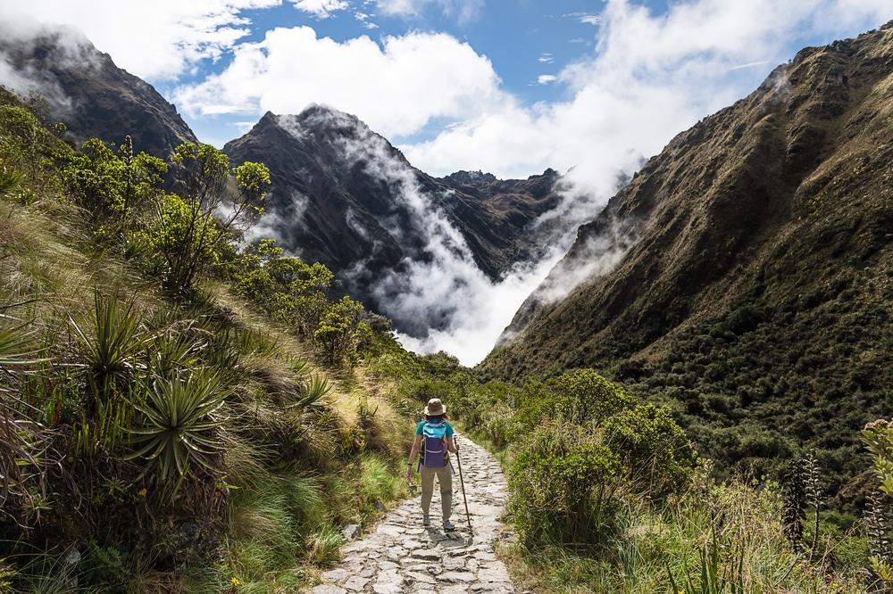 woman walking on Inca Trail in Machu Picchu Peru