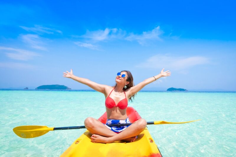 woman on a kayak on a beautiful island in summer