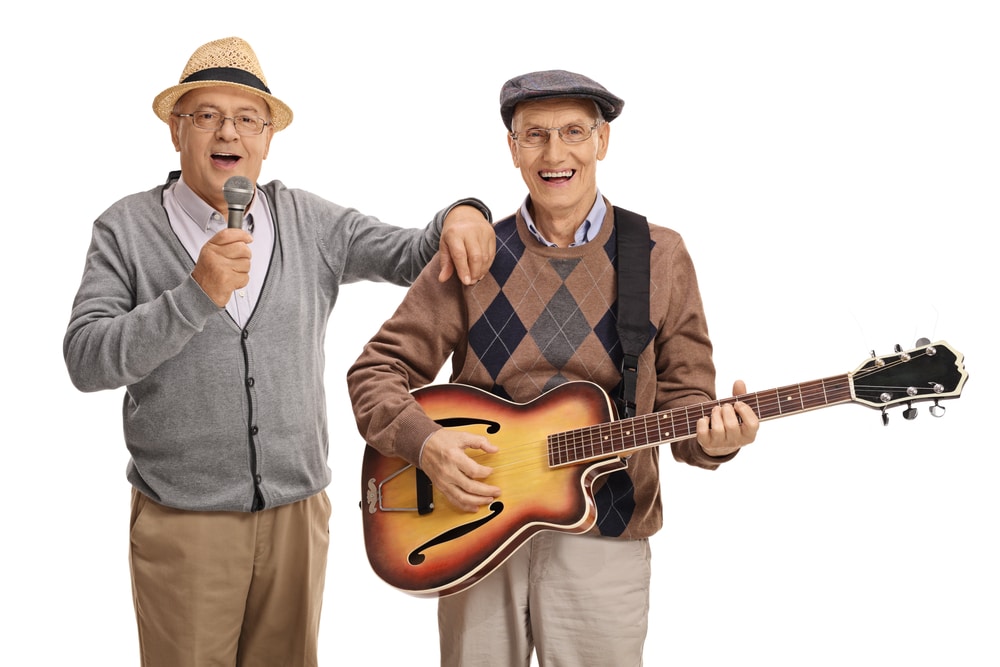 two-men-singing-with-guitar