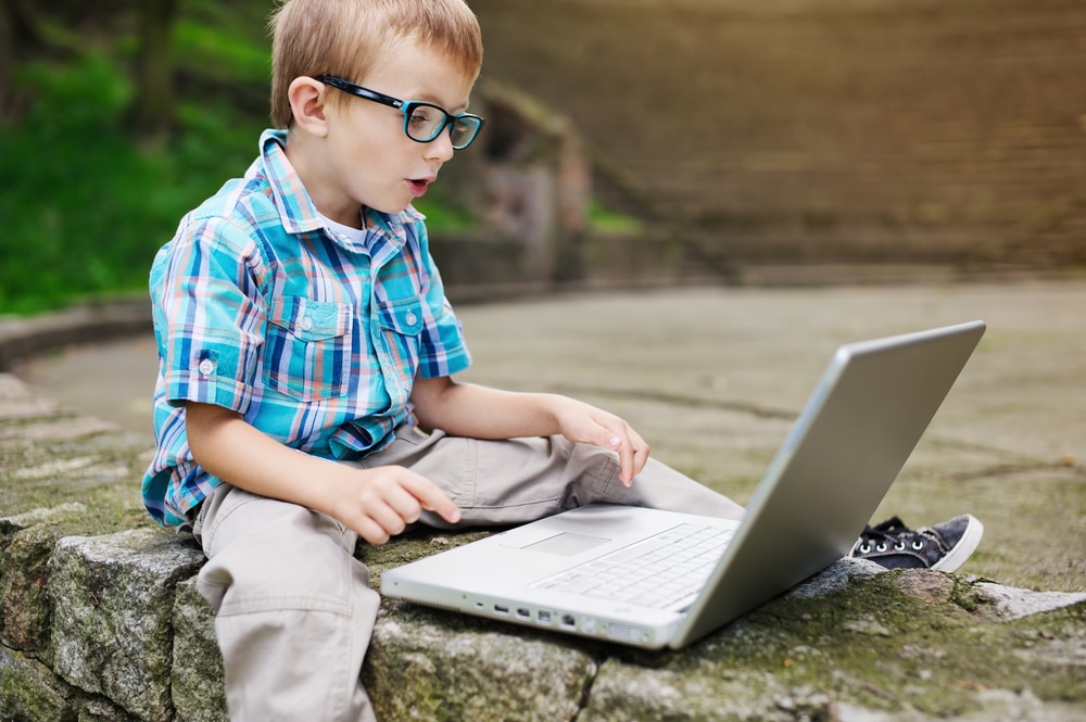 young-boy-looking-at-laptop