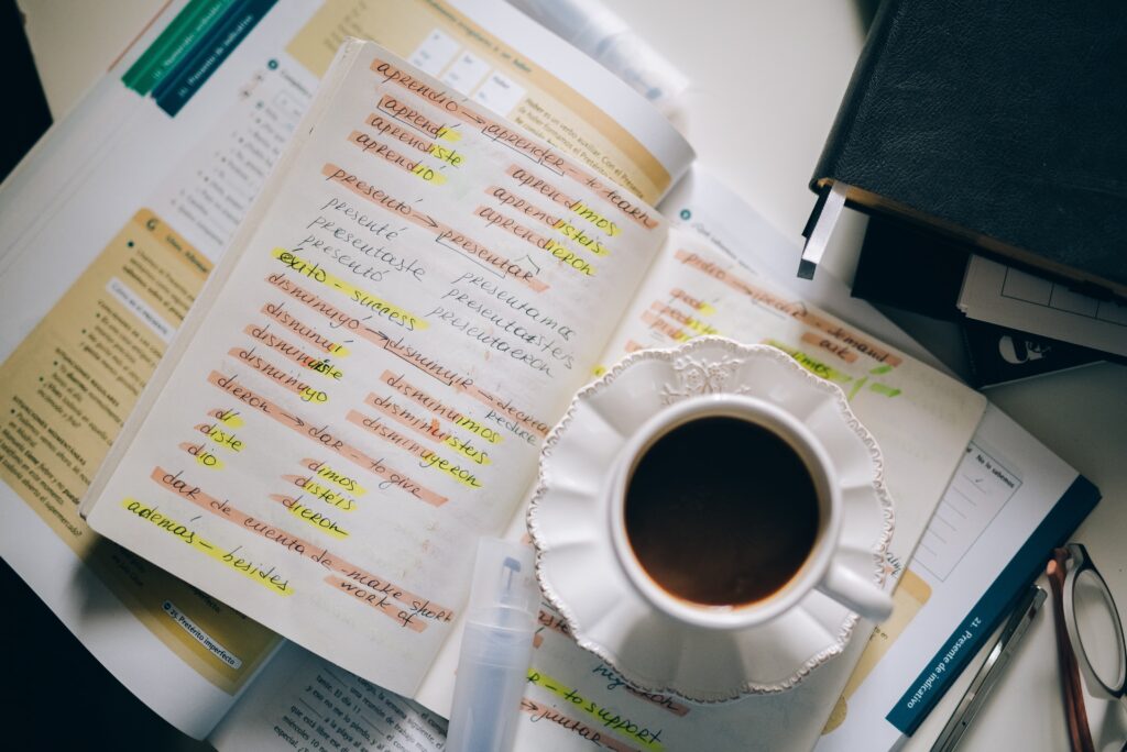 Photo by Leeloo Thefirst: https://www.pexels.com/photo/a-cup-of-black-coffee-on-a-notebook-with-notes-of-foreign-language-with-translation-5408919/