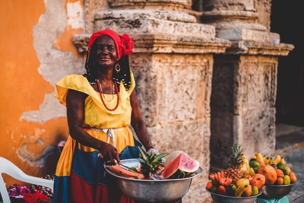 Woman selling fruit on the street in Colombia