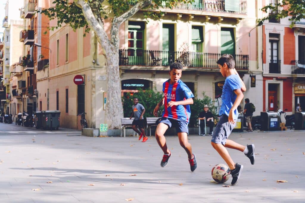 Boys playing soccer in Madrid, Spain