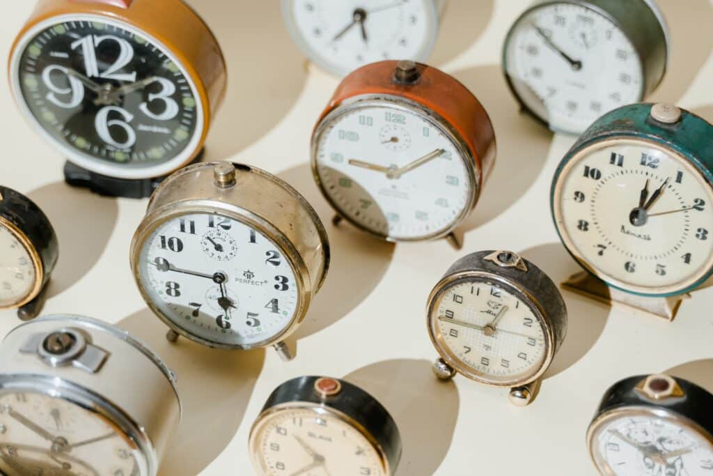 close-up-photo-of-vintage-alarm-clocks-showing-different-time-pexels