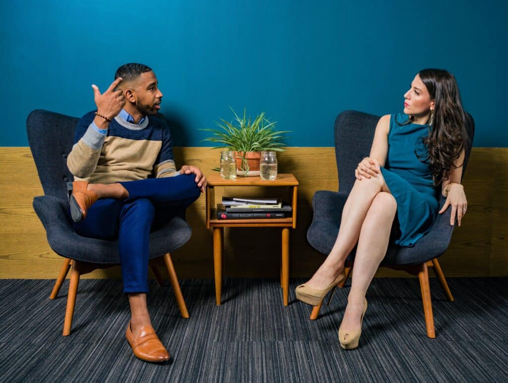 Photo by Jopwell: https://www.pexels.com/photo/woman-wearing-teal-dress-sitting-on-chair-talking-to-man-2422280/