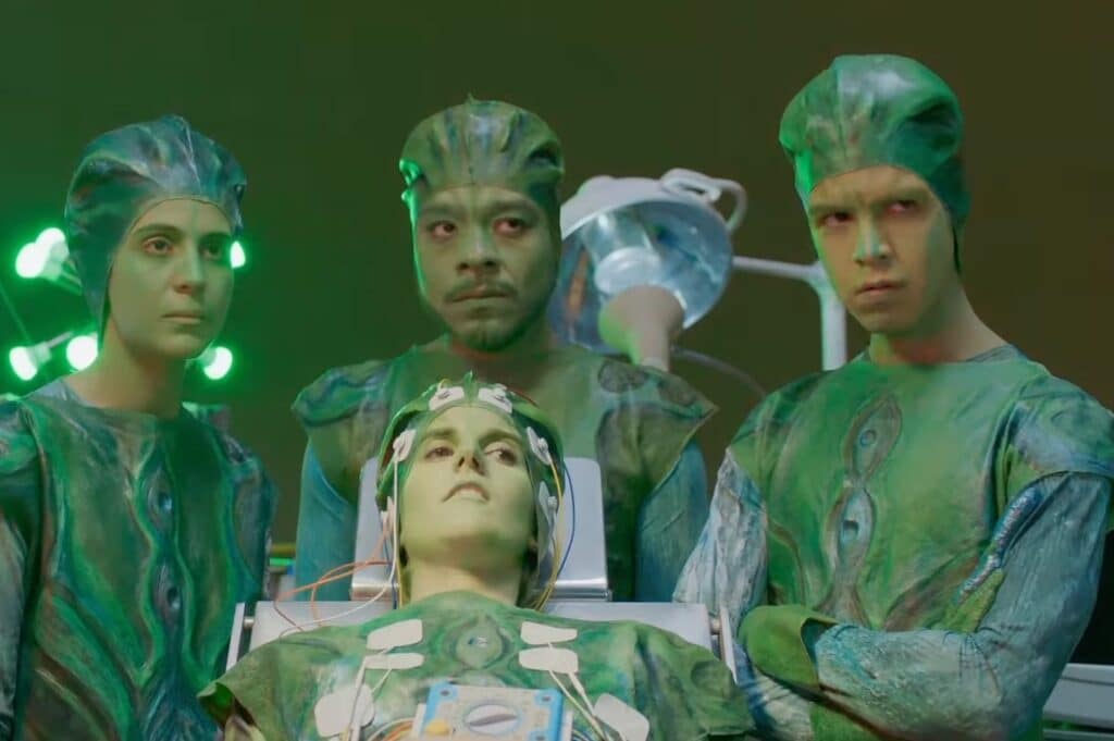 los-espookys-screenshot-with-four-main-characters-in-scrubs-and-covered-in-green