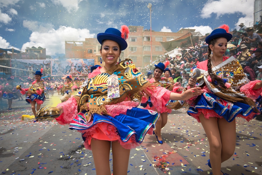 two women dancing in carnival in bolivia