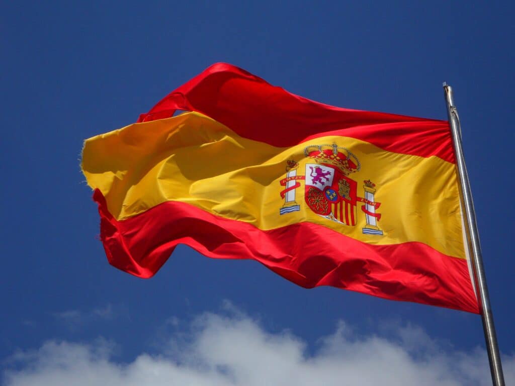 A Spanish flag flying on a flagpole