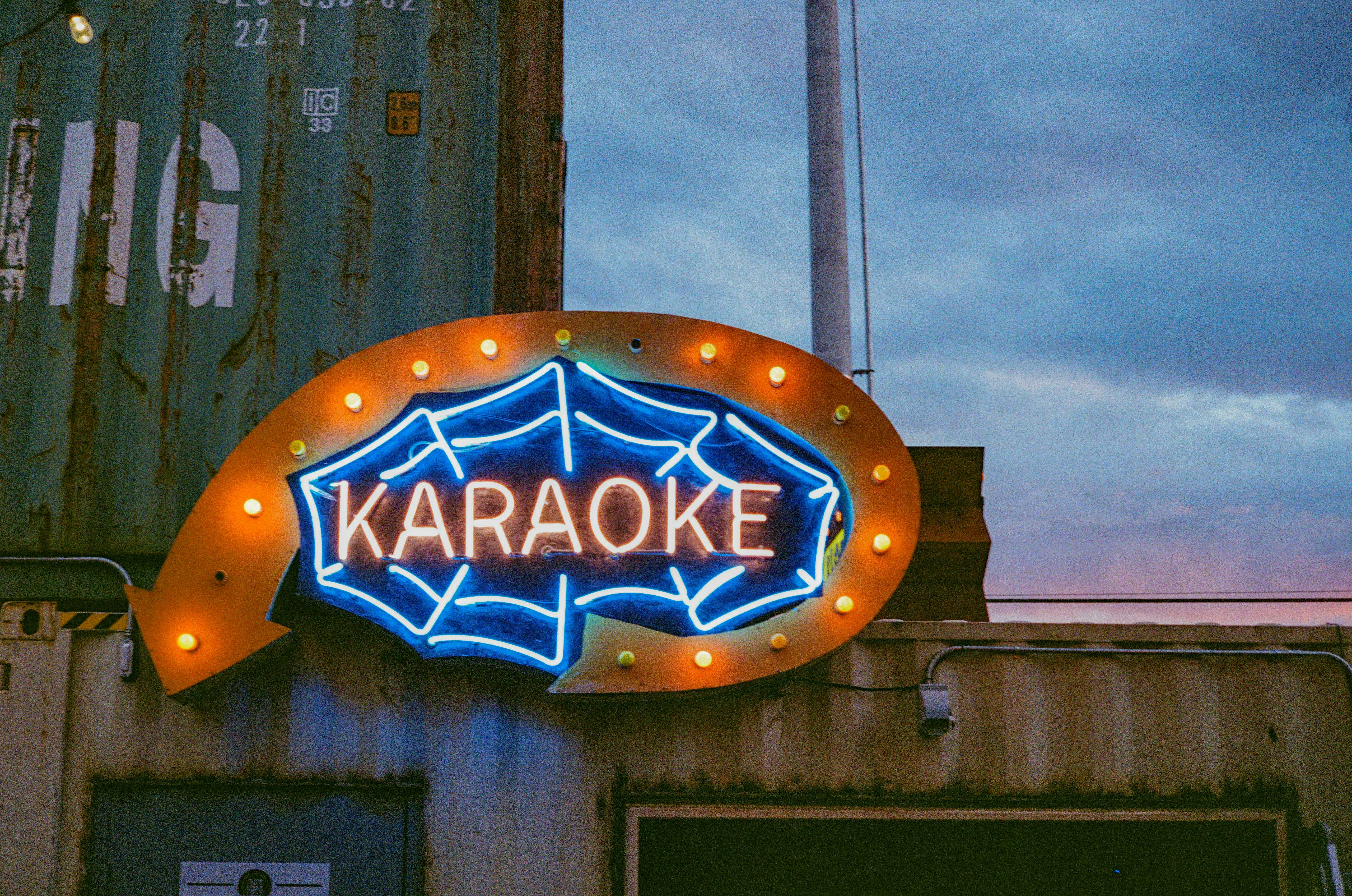 The neon sign for a karaoke bar