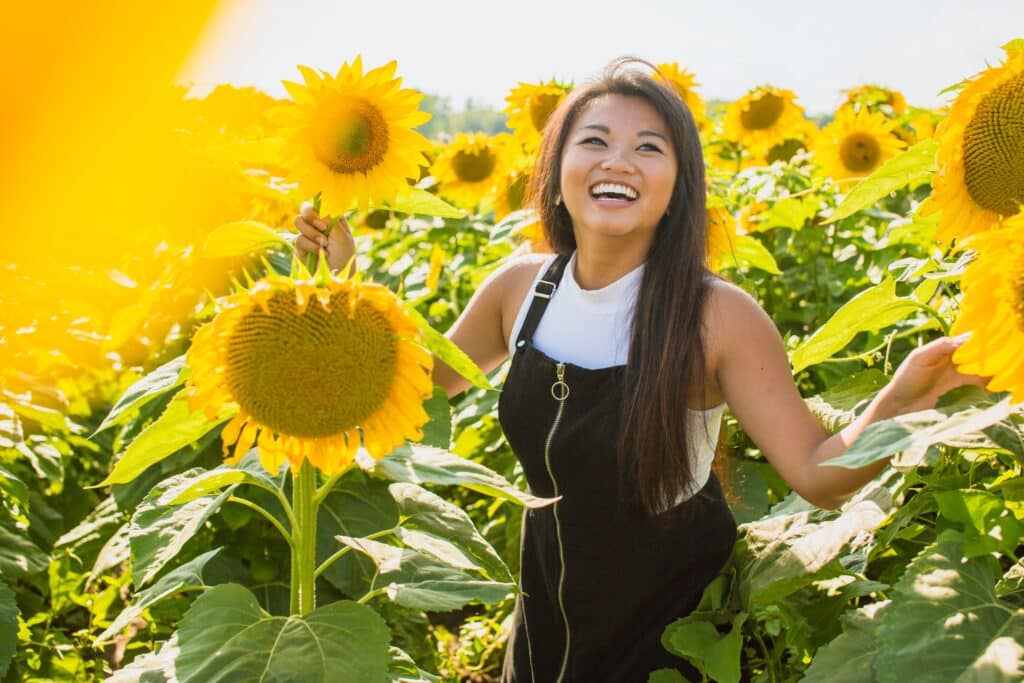 young-woman-in-field-of-sunflowers