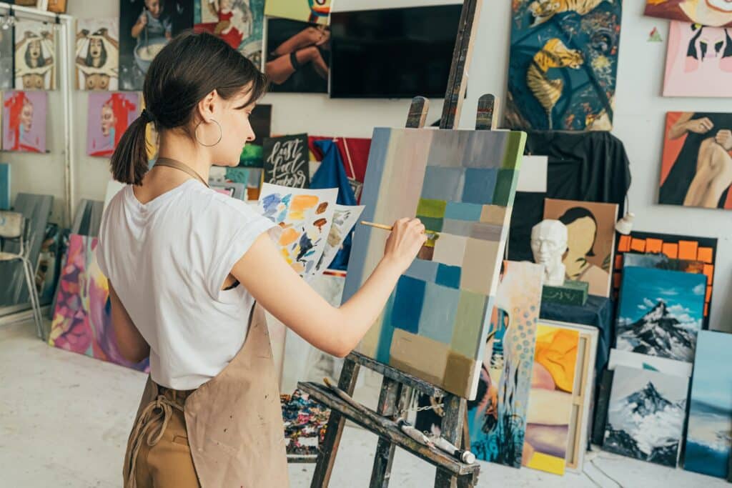 woman-painting-in-an-artist's-studio