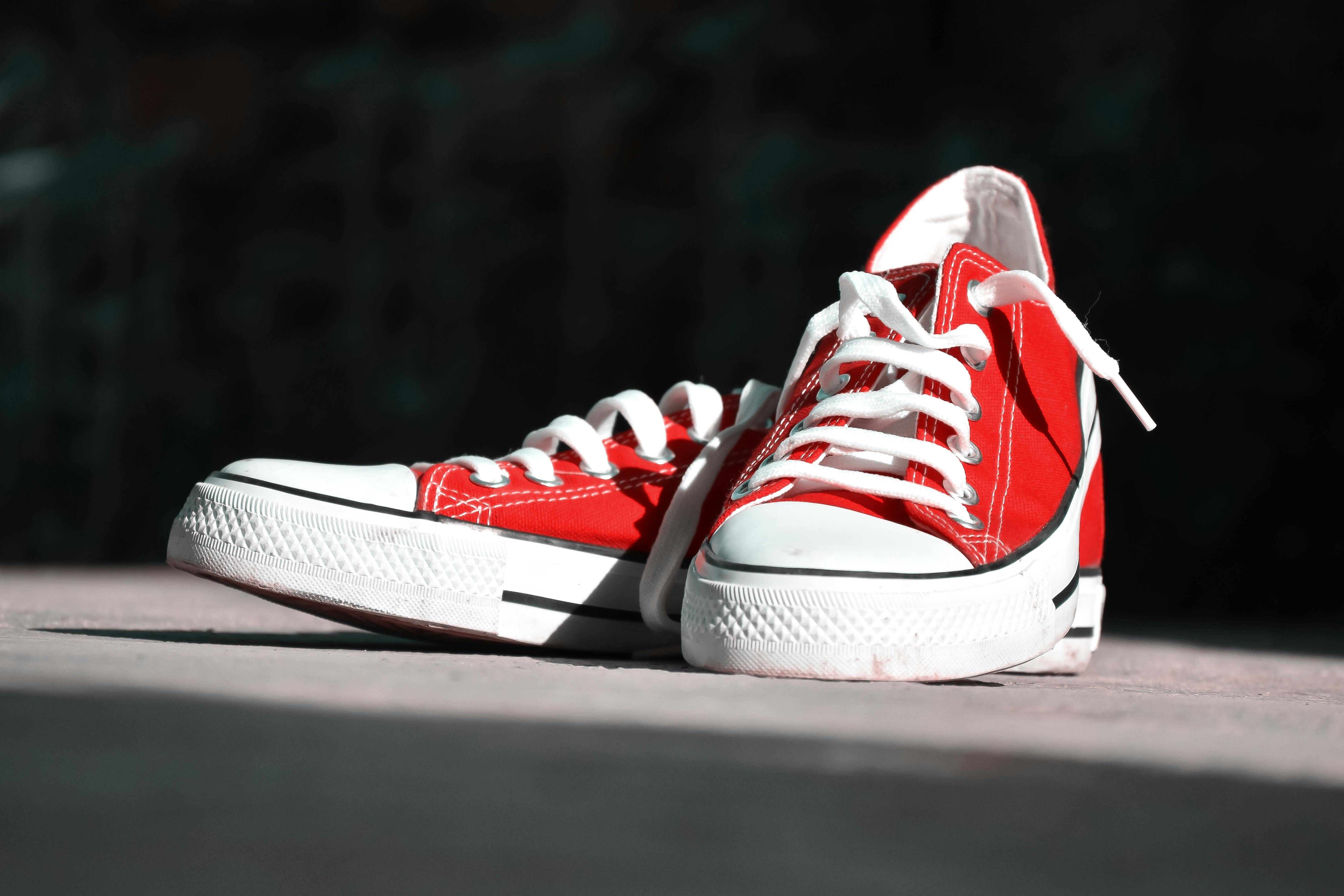A pair of red canvas sneakers