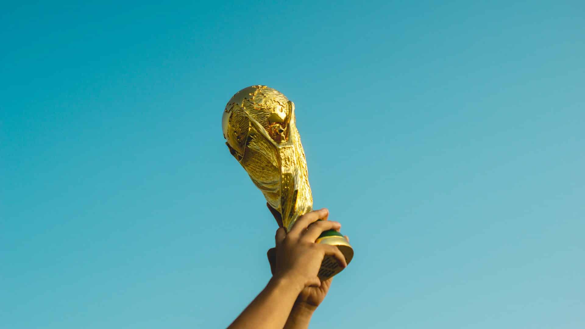 hands-holding-gold-trophy