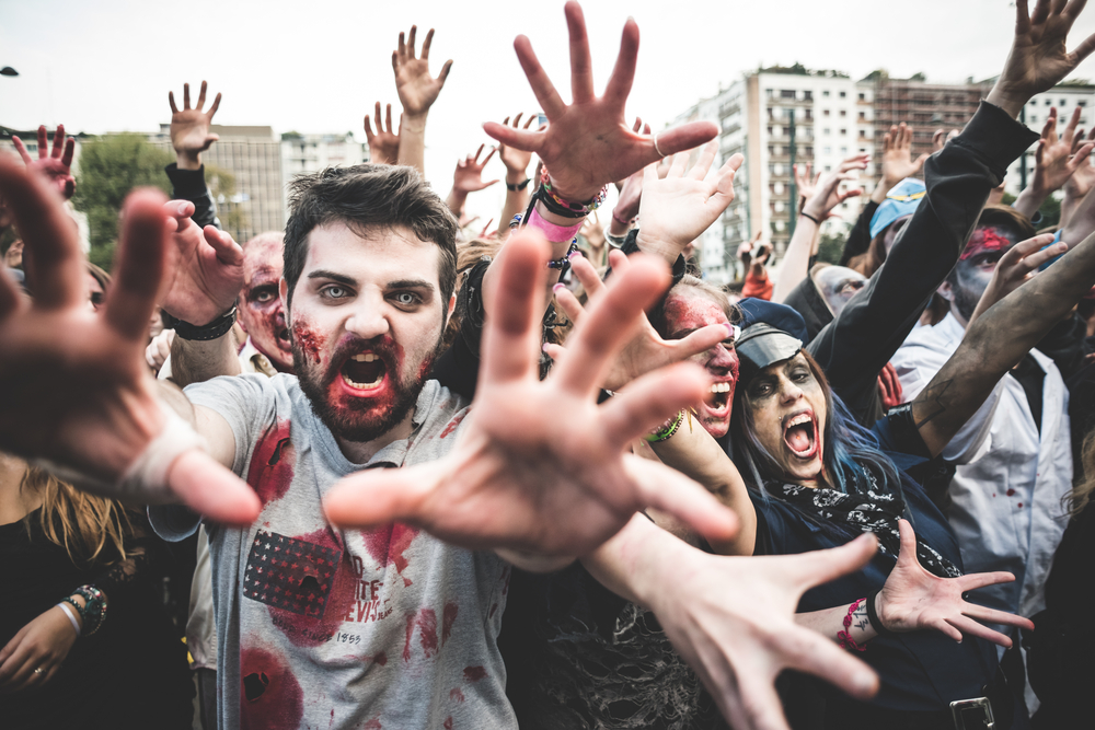 people-dressed-as-zombies-with-hands-out-facing-the-camera