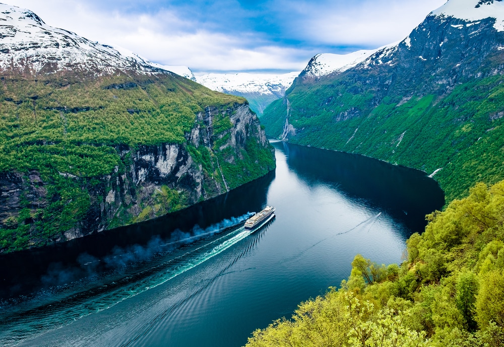 snow-topped mountains and a deep river in Norway