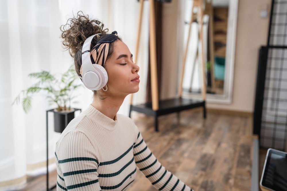 young-woman-meditating-with-headphones-on