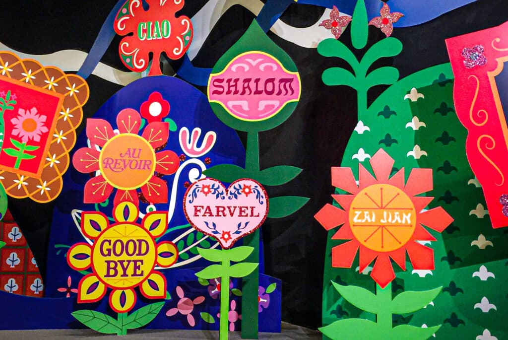An illustration of colorful flowers, each containing a different language