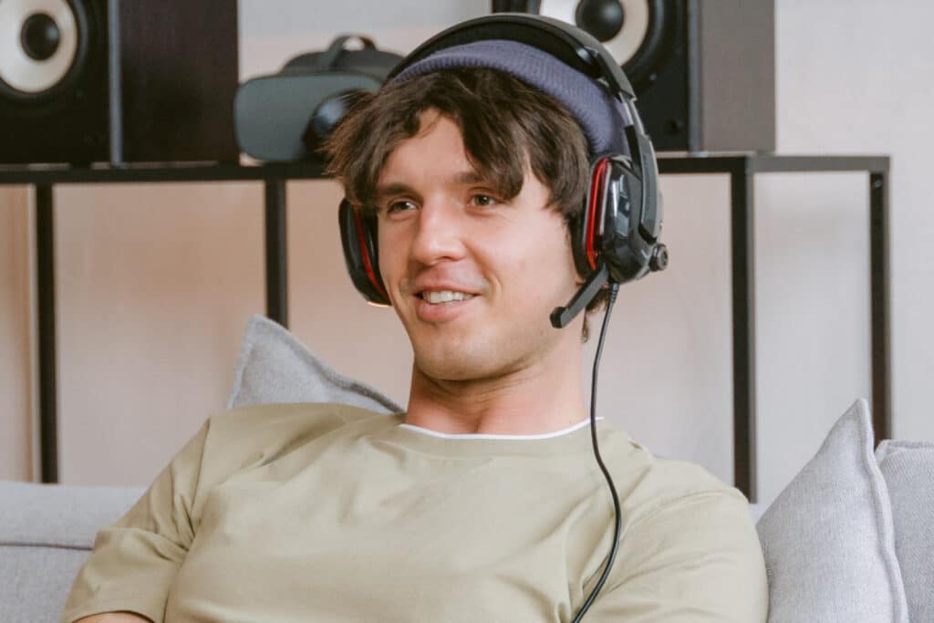 Man wearing headphones talking into mic