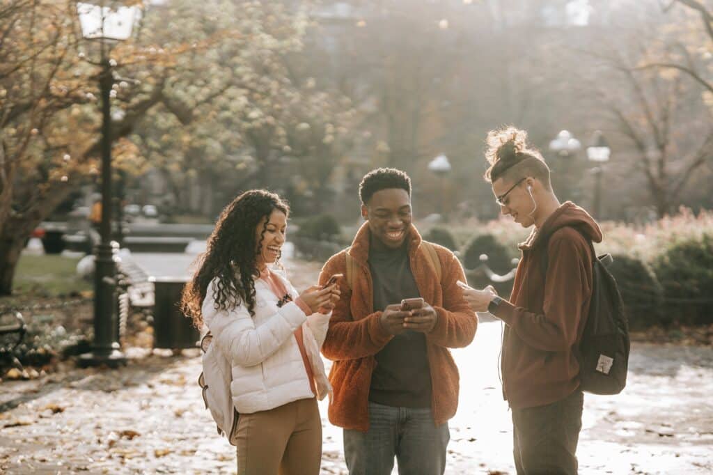 group-of-college-student-friends-on-phones-translation-apps