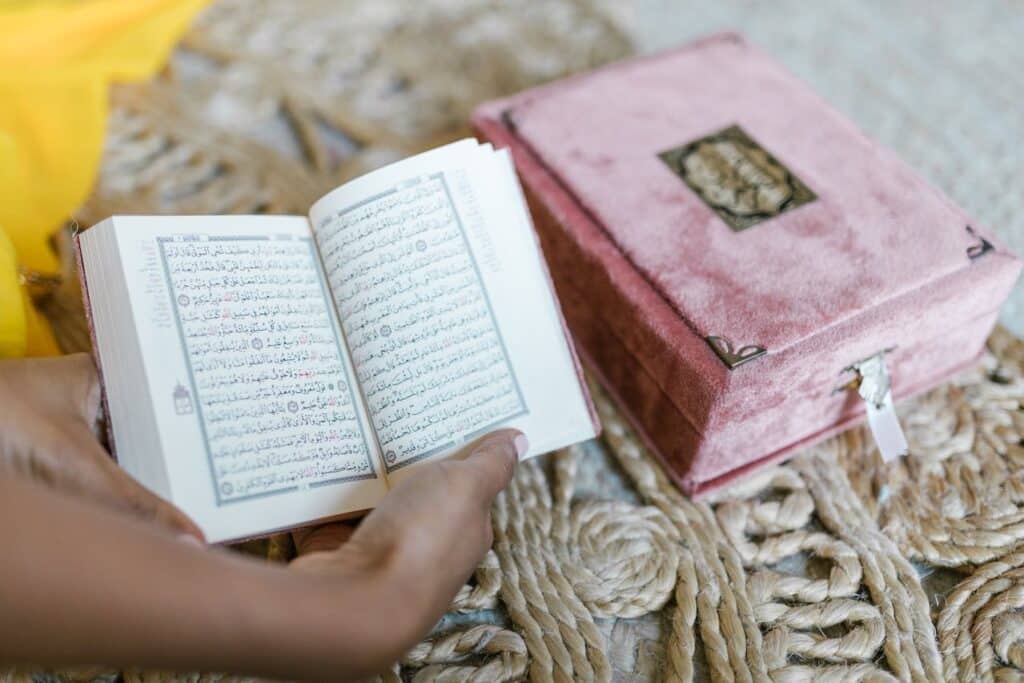 woman holding an arabic book